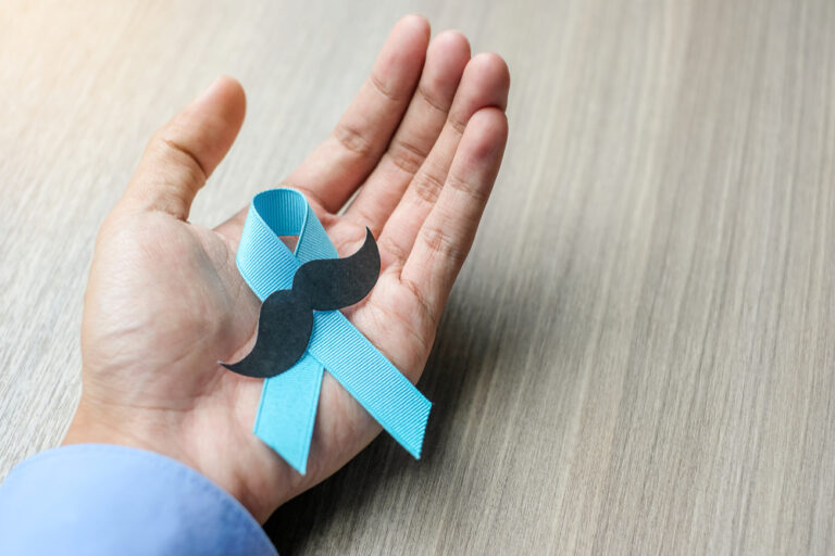 Prostate,Cancer,Awareness,,Man,Holding,Light,Blue,Ribbon,With,Mustache